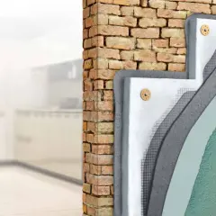 Corte de pared mostrando aislamiento y trasdosado pladur sobre ladrillo.