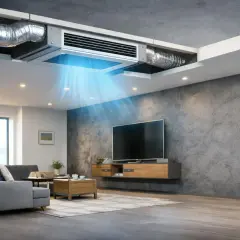 Salón moderno con climatización por conductos invisible, que distribuye aire fresco y azulado.