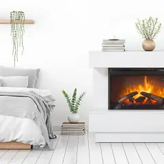 Habitación moderna con cama y chimenea eléctrica, uno de los tipos de estufas más populares.