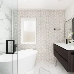 Baño moderno con bañera exenta, lavabo doble y azulejos de diseño. El **pladur para baños** permite estas paredes curvas y acabados impecables.