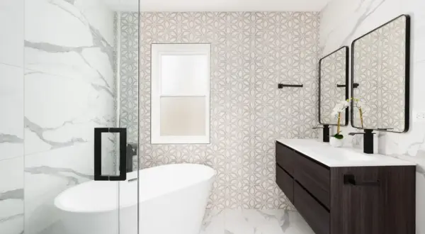 Baño moderno con bañera exenta, lavabo doble y azulejos de diseño. El **pladur para baños** permite estas paredes curvas y acabados impecables.