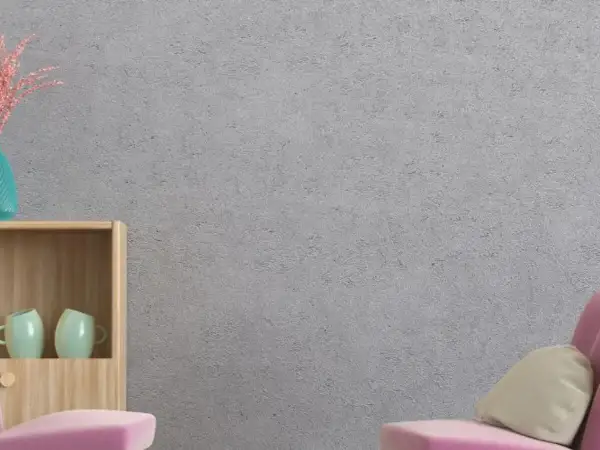 Estantería de madera con tazas, jarrón y un cojín sobre un sofá rosa. La pared tiene un acabado de gotelé, ideal para aplicar papel pintado sobre gotele.